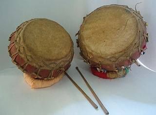Naqqara (Nagara) Kettledrums often in pairs, the smaller female and the larger male, made of earth, wood or metal, beaten with sticks vary in size from a few inches to feet in diameter. It should be of Persian origin.