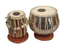 Tabla is the most famous Indian drum, which actually consists of a tuned pair of drums - one for bass tones usually made of metal and another for higher tones made of wood, both overlaid with a black patch of iron oxide, gum arabic & other unknown substances in the centre. Under medieval Islamic influence in the northern part of the subcontinent, Middle Eastern hand percussion especially the Darbuka could have influenced Indian rhythm. This synthesis culminated in the development (possibly from the PakhAwaj) of the Tabla. Some scholars  suggest that an intermediate form called the Dukkar existed. Tabla is also popular among Western fusion musicians.